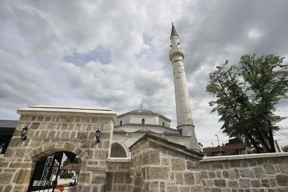 Community gathering at the Arnaudija Mosque reopening in Banja Luka, showcasing the restored architecture and vibrant cultural celebration