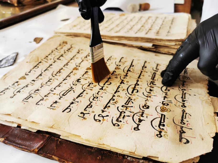 TİKA's team working on preserving and digitalizing Ottoman period manuscripts in Laghouat, Algeria.