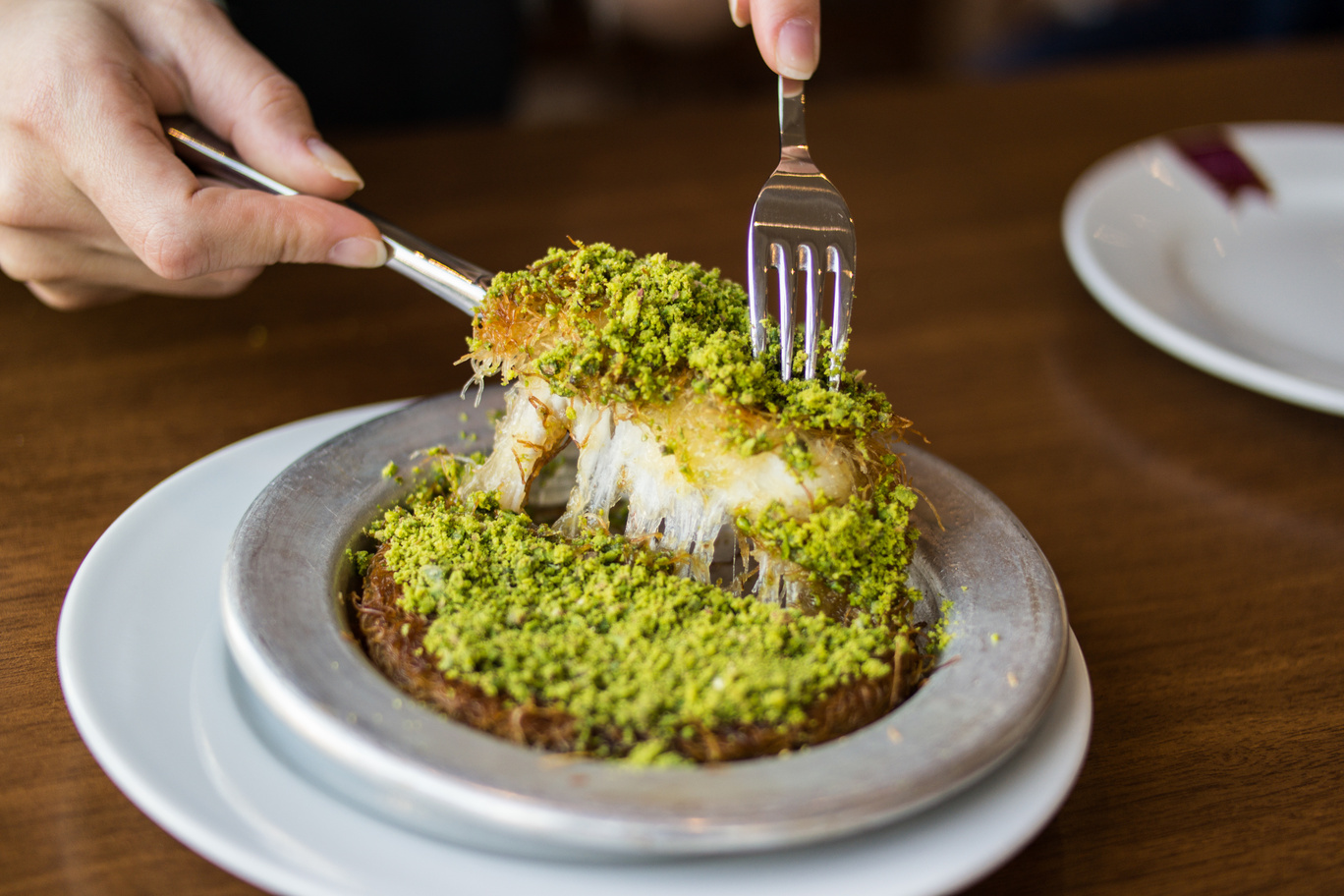 Turkish cuisine's global stars: 10 dishes everyone loves 8 A warm, crispy dessert made with shredded phyllo dough, melted cheese, and sweet syrup, topped with pistachios