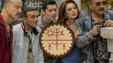 Four men and a woman peer intently in the same direction, one holding binoculars, with a round sun, tree and moon emblem in the center